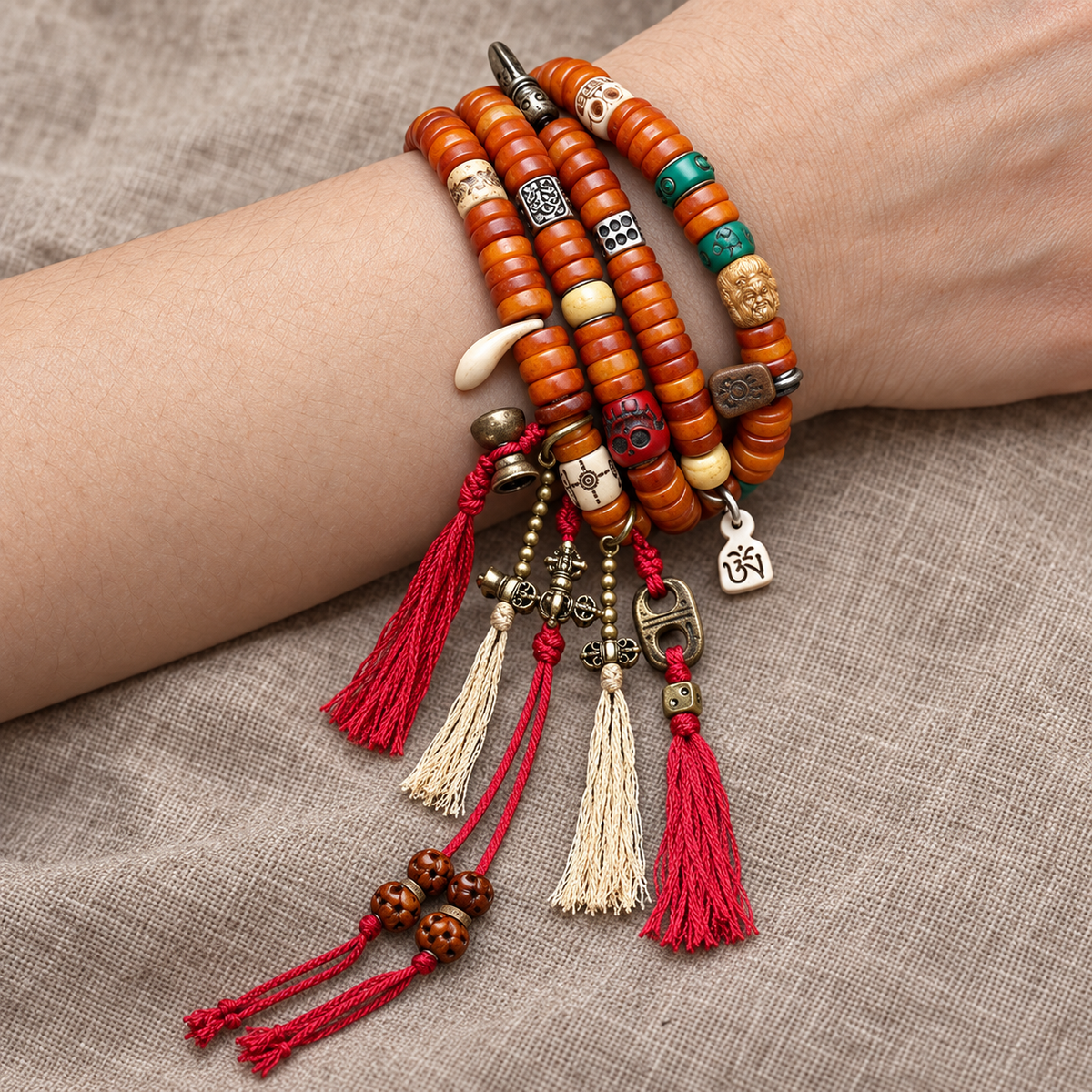 EverestArtstudios Bone 108-Bead Mala with Carved and Metal-Tone Accents — wrist resting