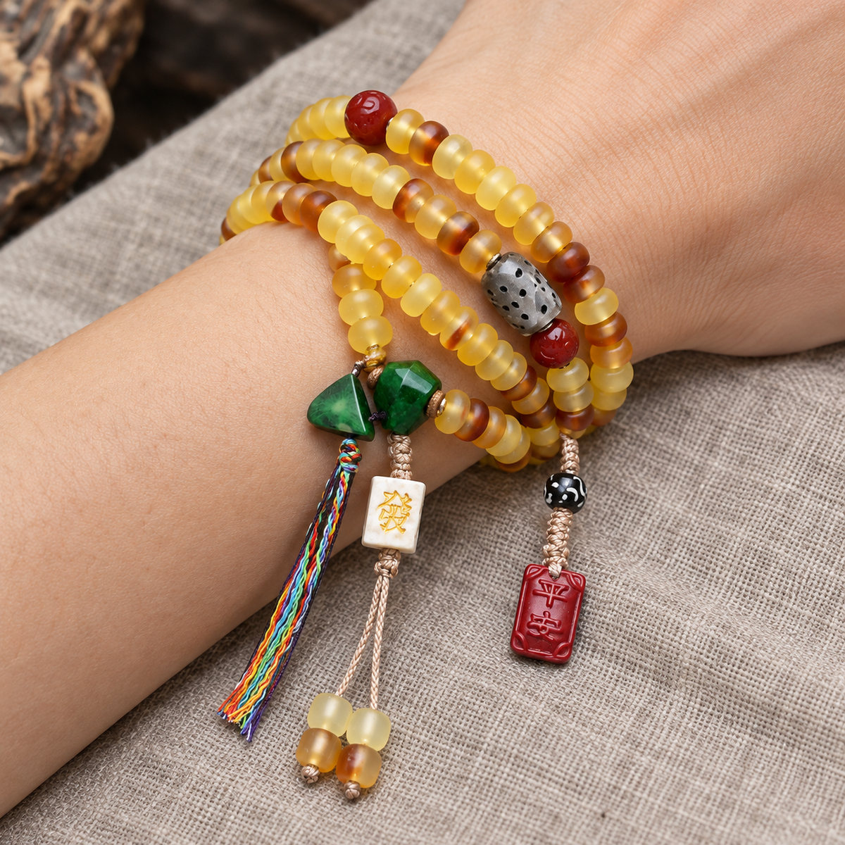 EverestArtstudios Golden Armor Disc-Bead Mala with Agate Accents — wrist resting
