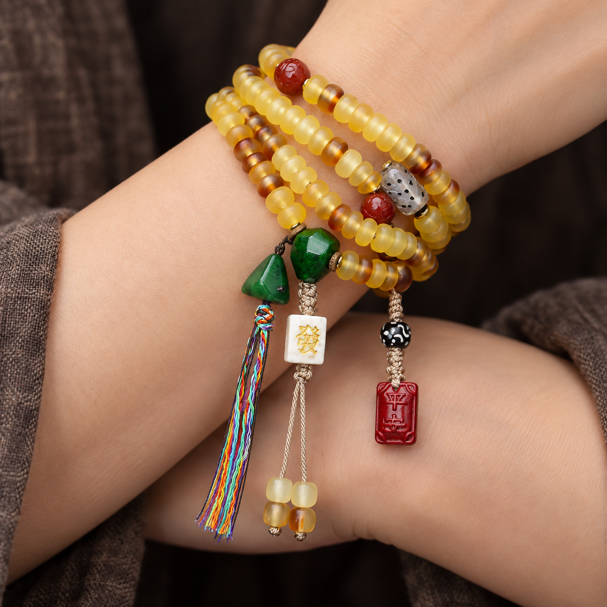 EverestArtstudios Golden Armor Disc-Bead Mala with Agate Accents — wrist crossed