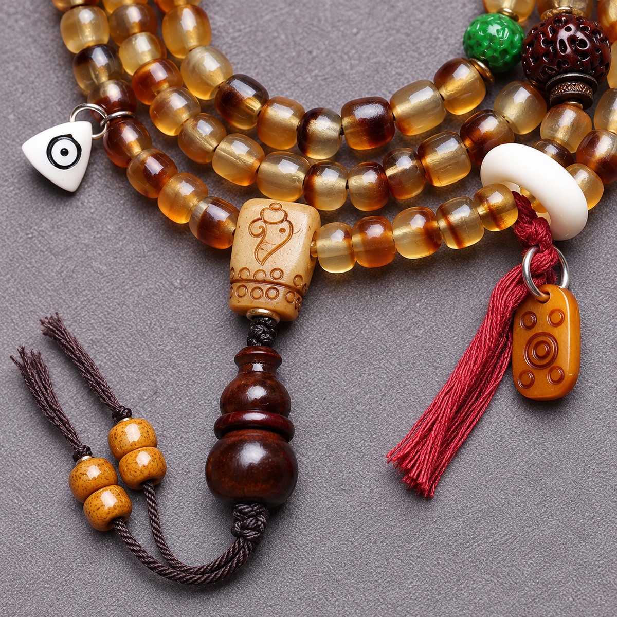 EverestArtstudios Golden Armor Barrel-Bead Mala with Vajra Bodhi and Horn Accents — connection detail