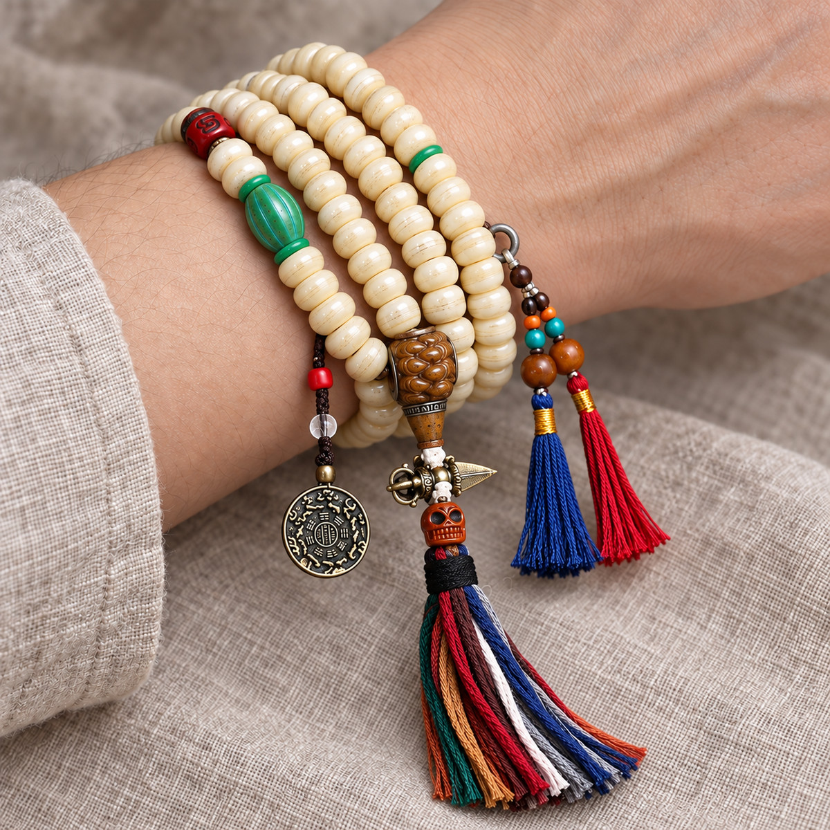 EverestArtstudios Camel Bone 108-Bead Mala with Bagua Motif and Tassels — wrist resting