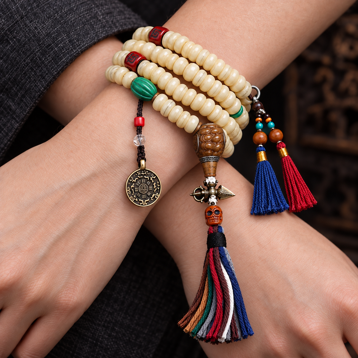 EverestArtstudios Camel Bone 108-Bead Mala with Bagua Motif and Tassels — wrist crossed