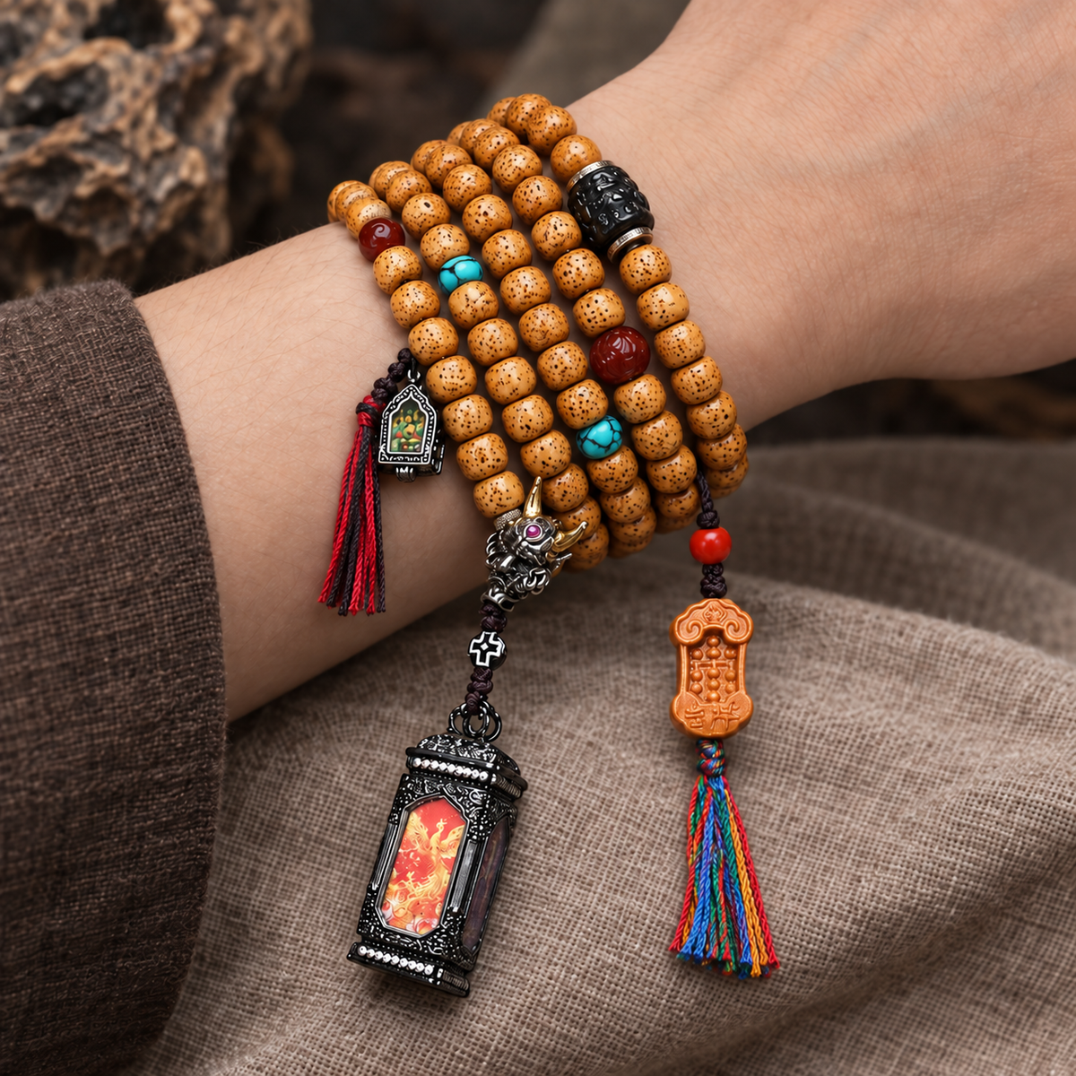 EverestArtstudios Xingyue Bodhi 108-Bead Mala with Four-Sided Thangka-Style Pendant — wrist resting