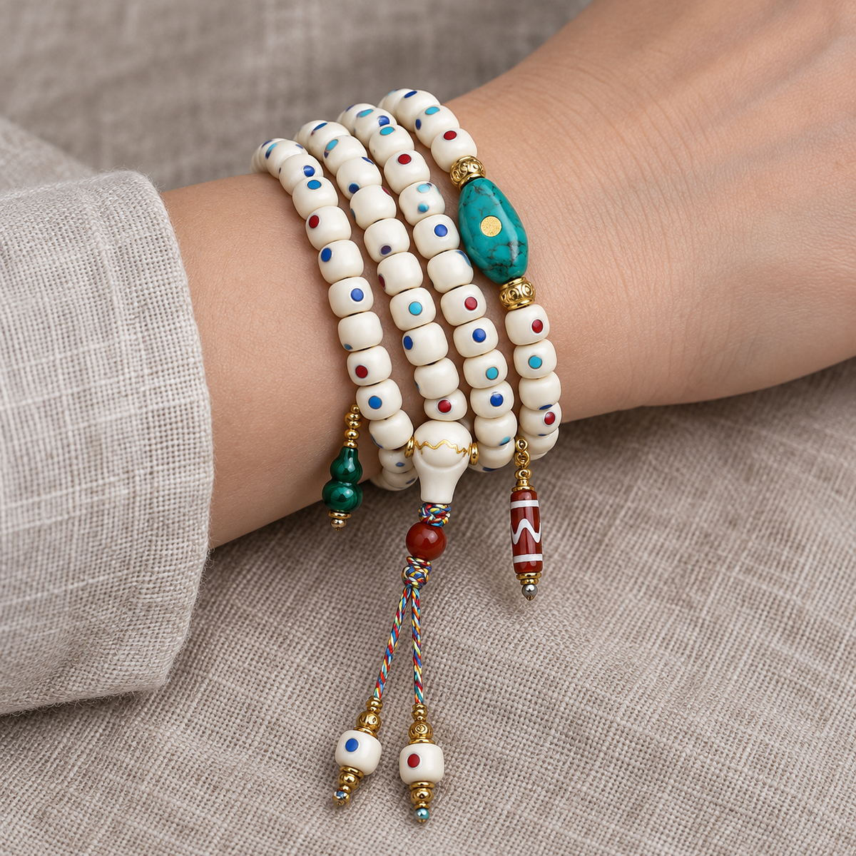 EverestArtstudios Inlaid Deer Bone 108-Bead Mala with Agate and Coconut Accents — wrist resting