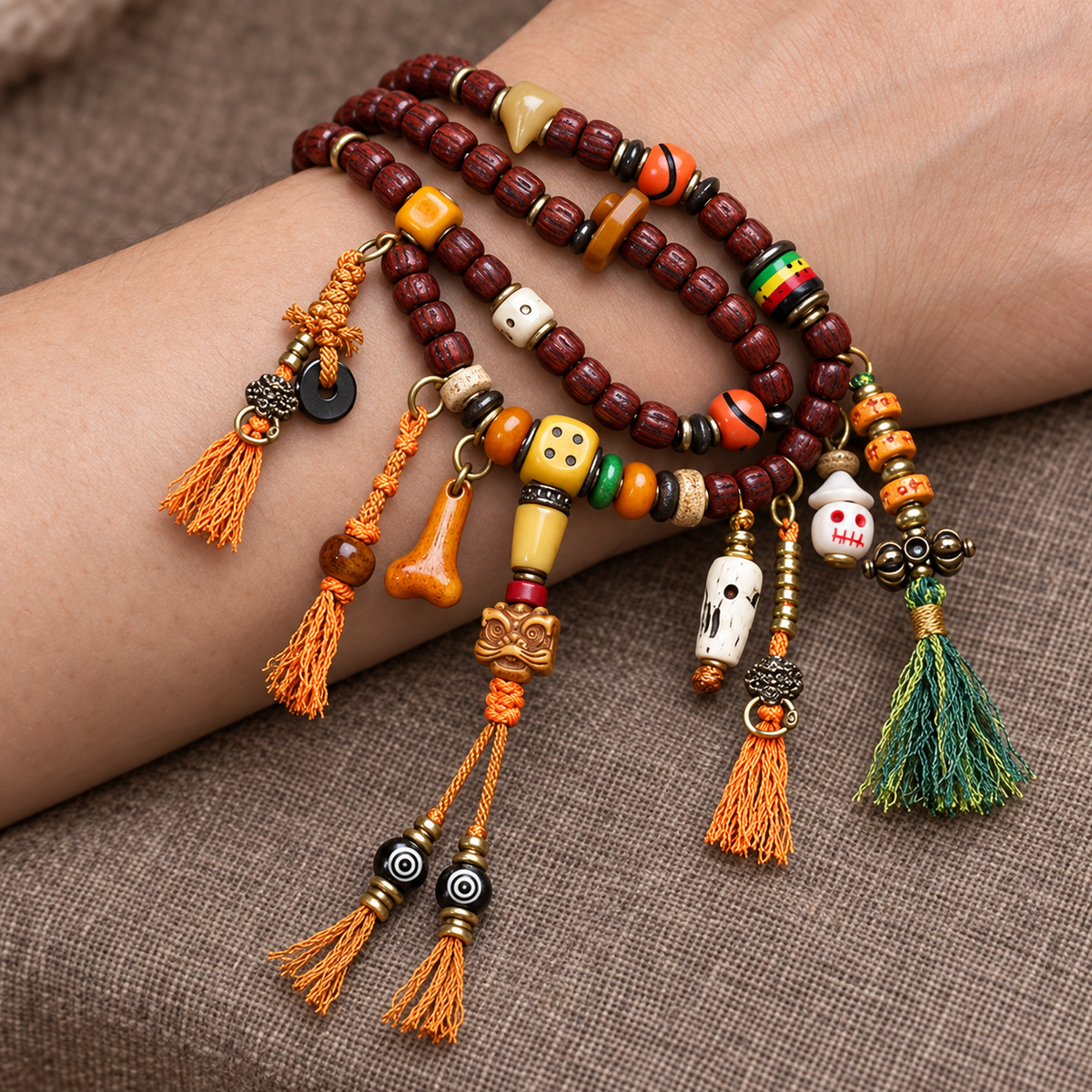 EverestArtstudios Cut Bodhi Seed 108-Bead Mala with Pixiu and Vajra Motif Charms — wrist resting