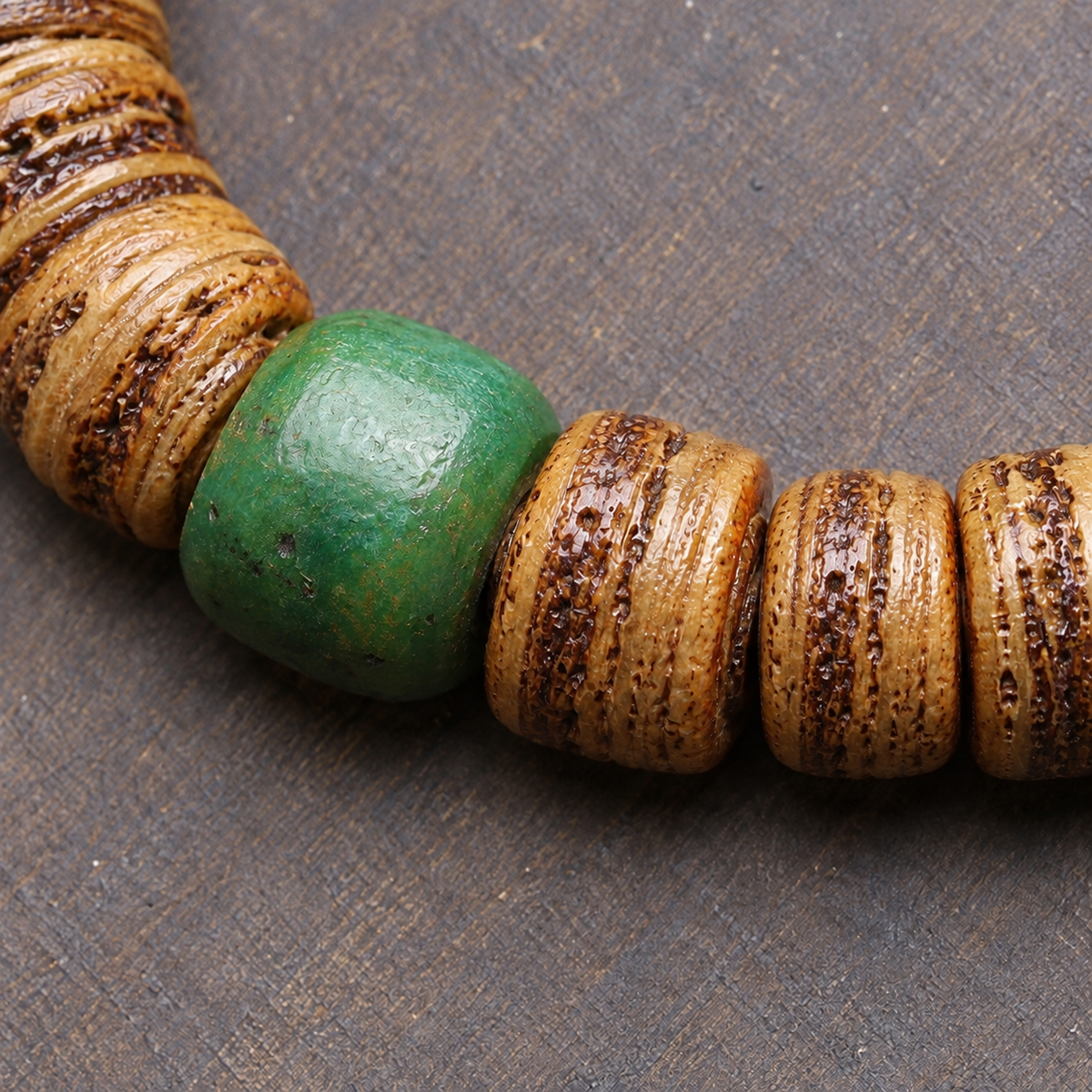 EverestArtstudios Camel Bone 108-Bead Mala with Carved Mahakala-Inspired Accent — surface detail