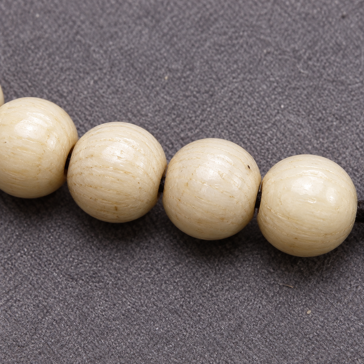 EverestArtstudios Bone 108-Bead Mala with Safety Ring and Vajra Motif Charms — surface detail