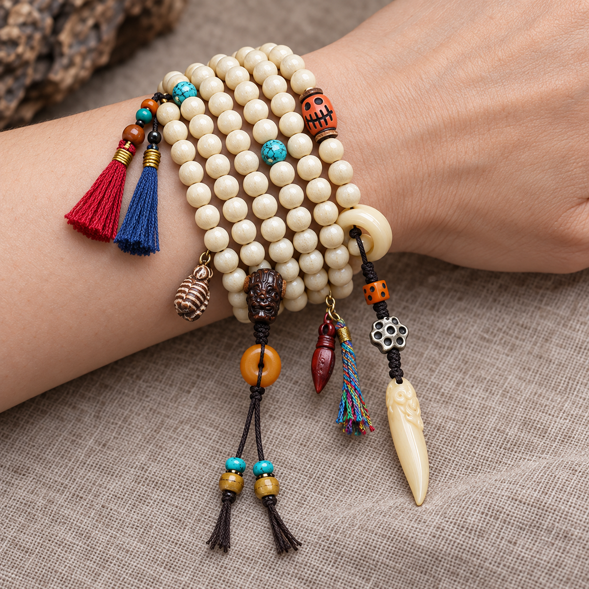 EverestArtstudios Bone 108-Bead Mala with Safety Ring and Vajra Motif Charms — wrist resting