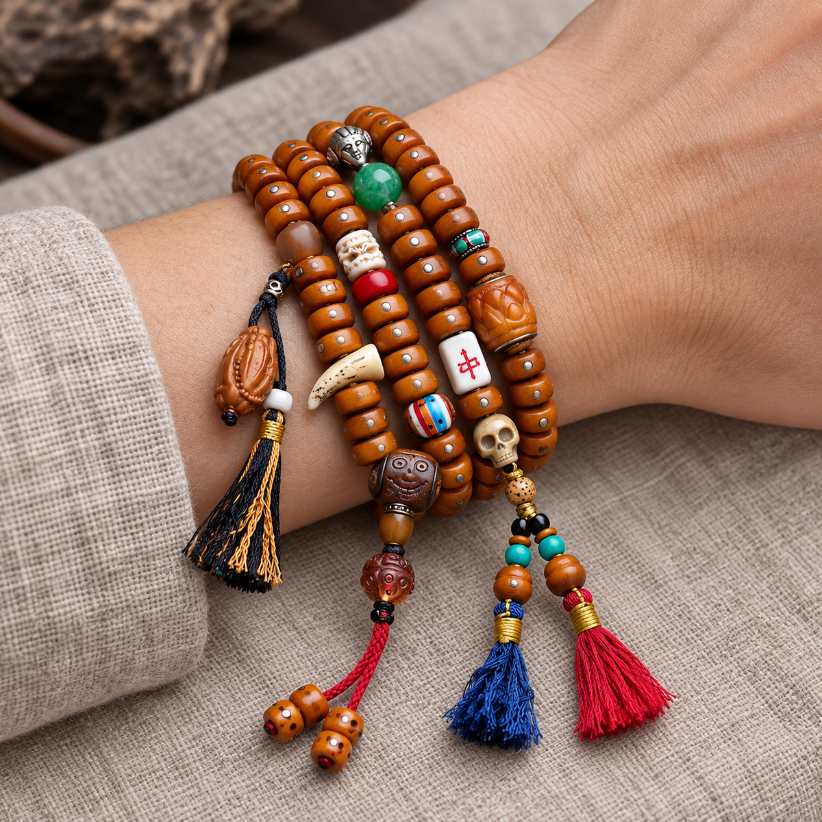 EverestArtstudios Metal-Inlaid Yak Bone 108-Bead Mala with Glass Accents — wrist resting