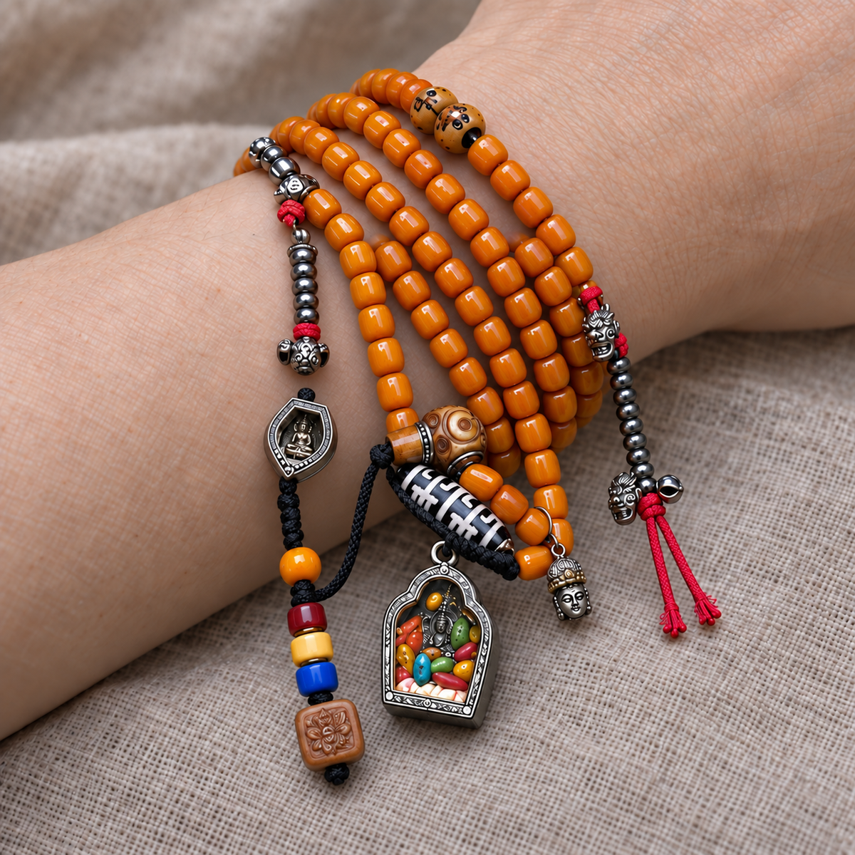 EverestArtstudios Bone 108-Bead Mala with Ghau and Zakiram-Inspired Pendant — wrist resting