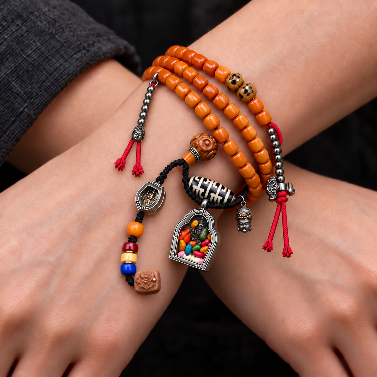 EverestArtstudios Bone 108-Bead Mala with Ghau and Zakiram-Inspired Pendant — wrist crossed