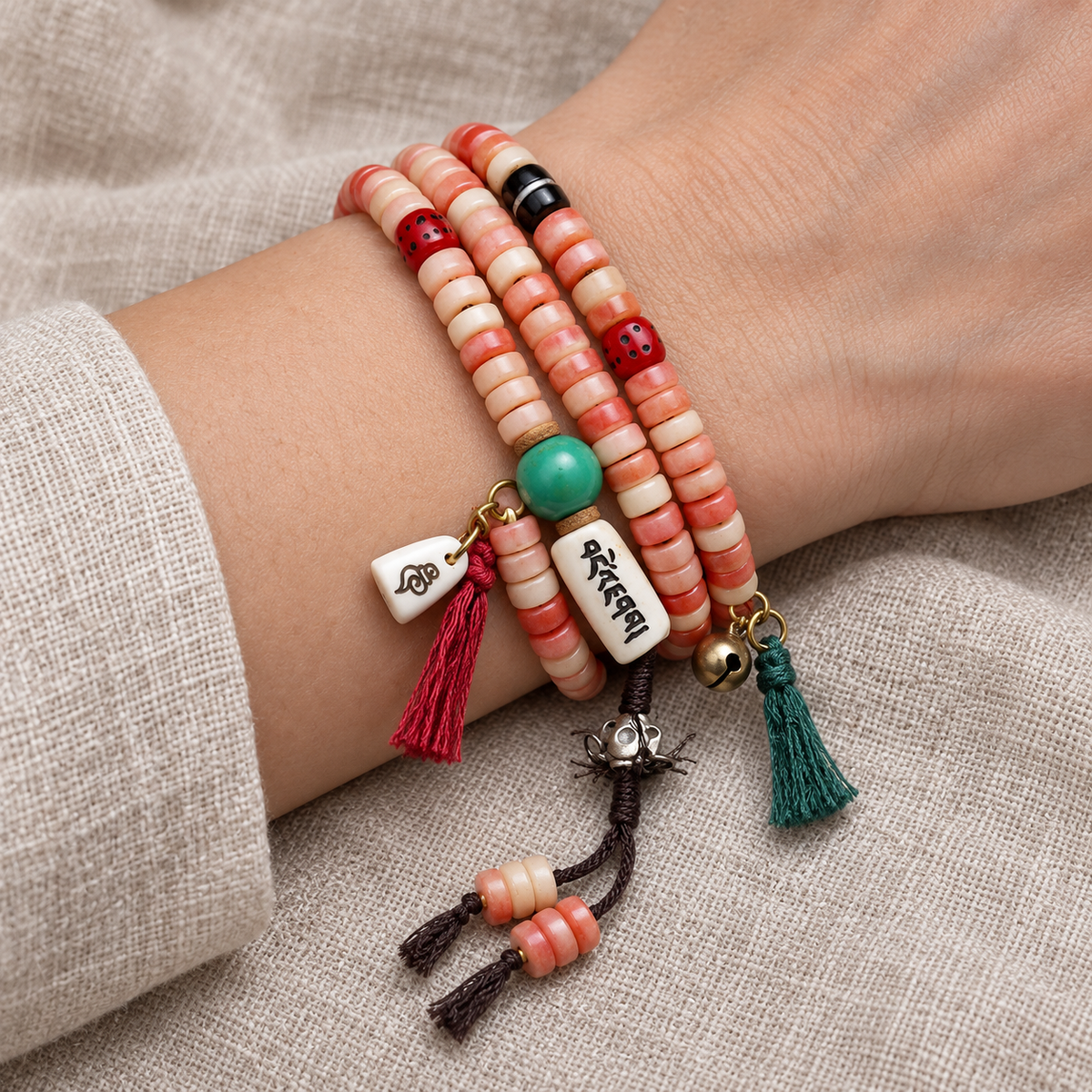 EverestArtstudios Camel Bone 108-Bead Mala with Coconut and Decorative Accents — wrist resting