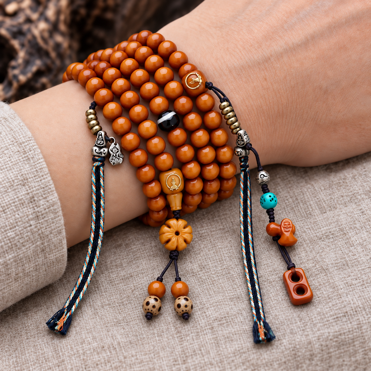 EverestArtstudios Yak Bone 108-Bead Mala with Agate and Faceless Buddha Motif — wrist resting