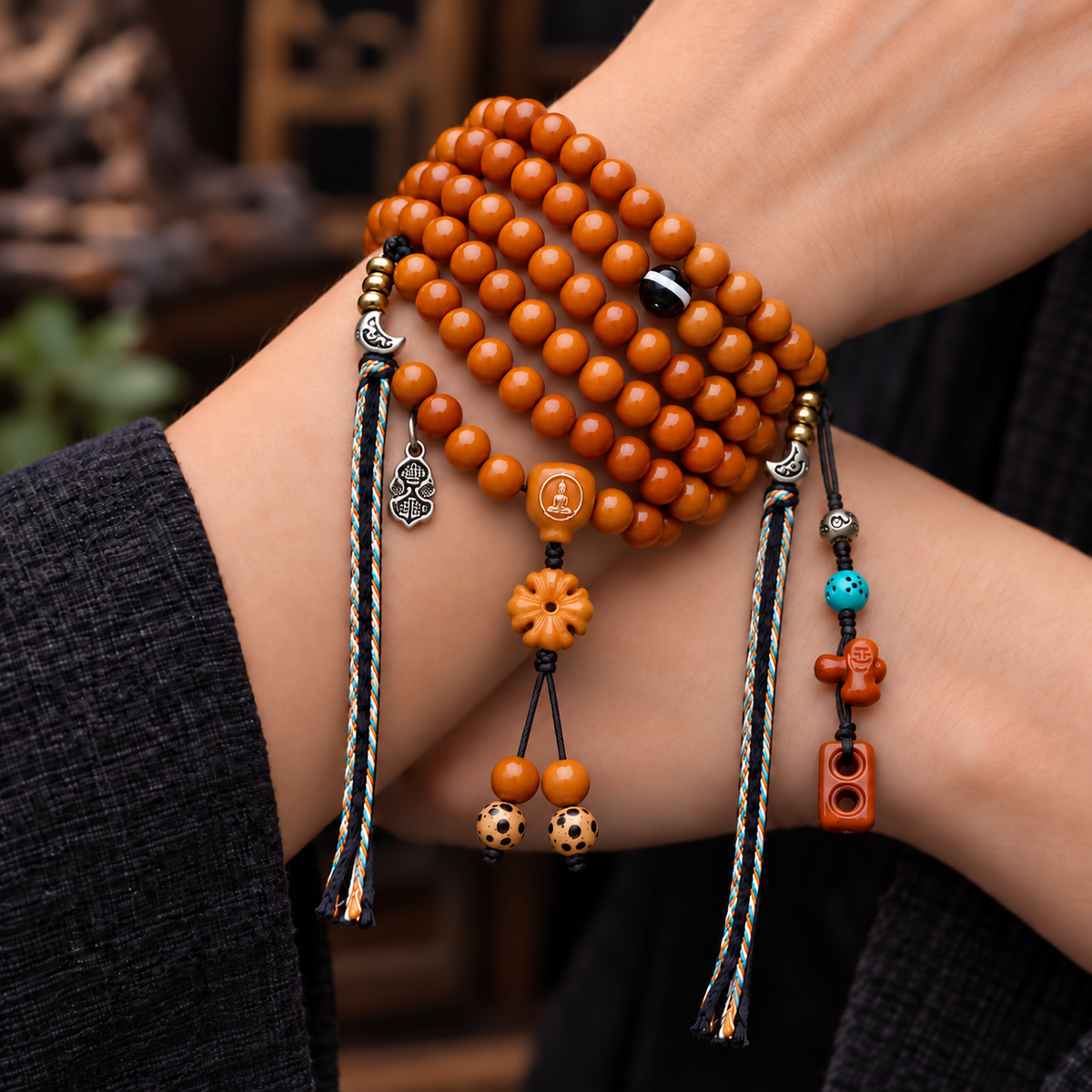 EverestArtstudios Yak Bone 108-Bead Mala with Agate and Faceless Buddha Motif — wrist crossed
