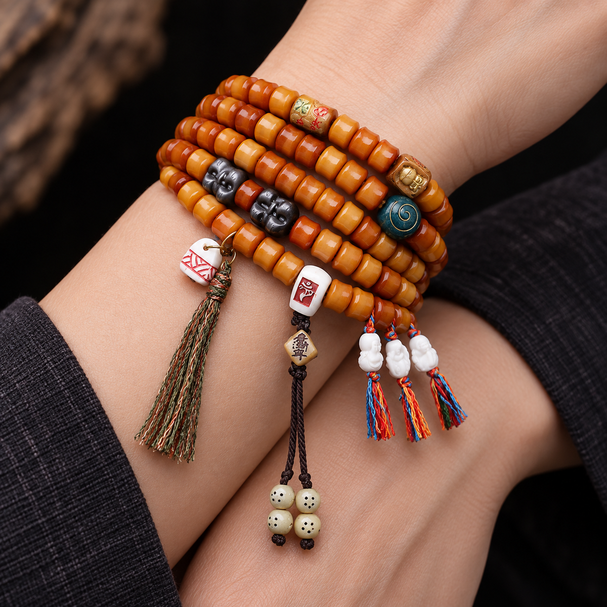 EverestArtstudios Bamboo-Carved Yak Bone 108-Bead Mala with Obsidian Accents — wrist crossed