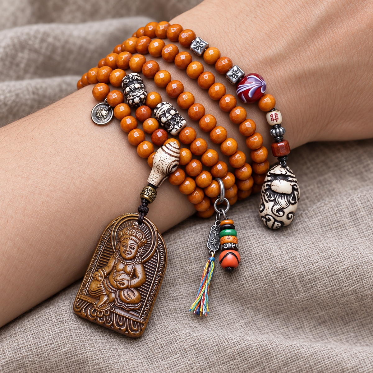 EverestArtstudios 108-Bead Mala with Wealth Deity Pendant and Yak Bone Accents — wrist resting