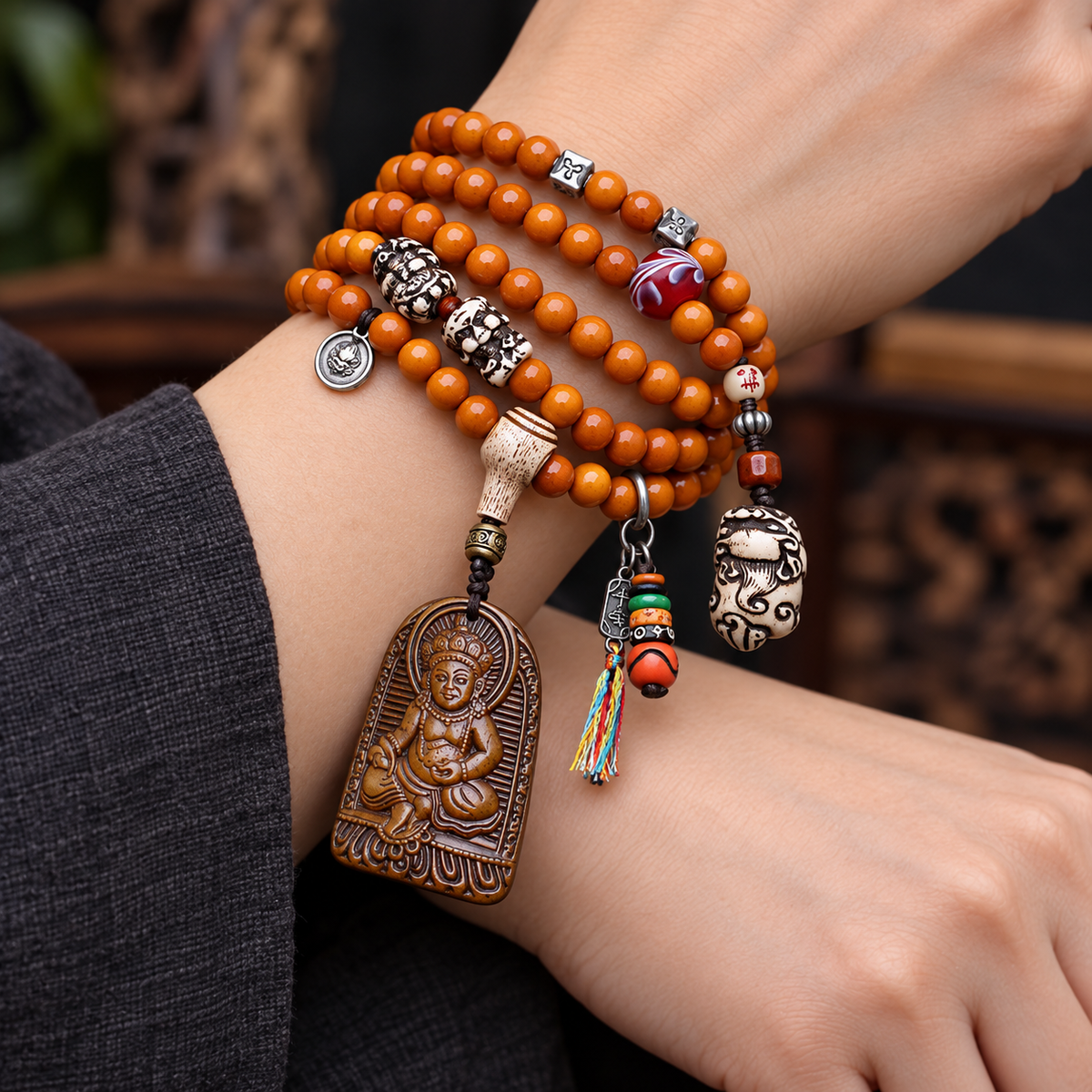 EverestArtstudios 108-Bead Mala with Wealth Deity Pendant and Yak Bone Accents — wrist crossed