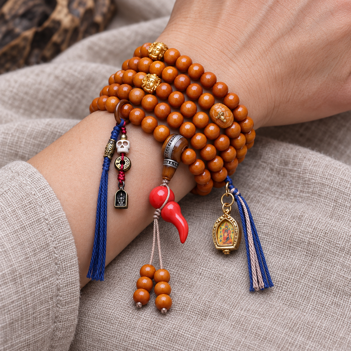 EverestArtstudios Camel Bone 108-Bead Mala with Thangka-Style Ghau Pendant — wrist resting