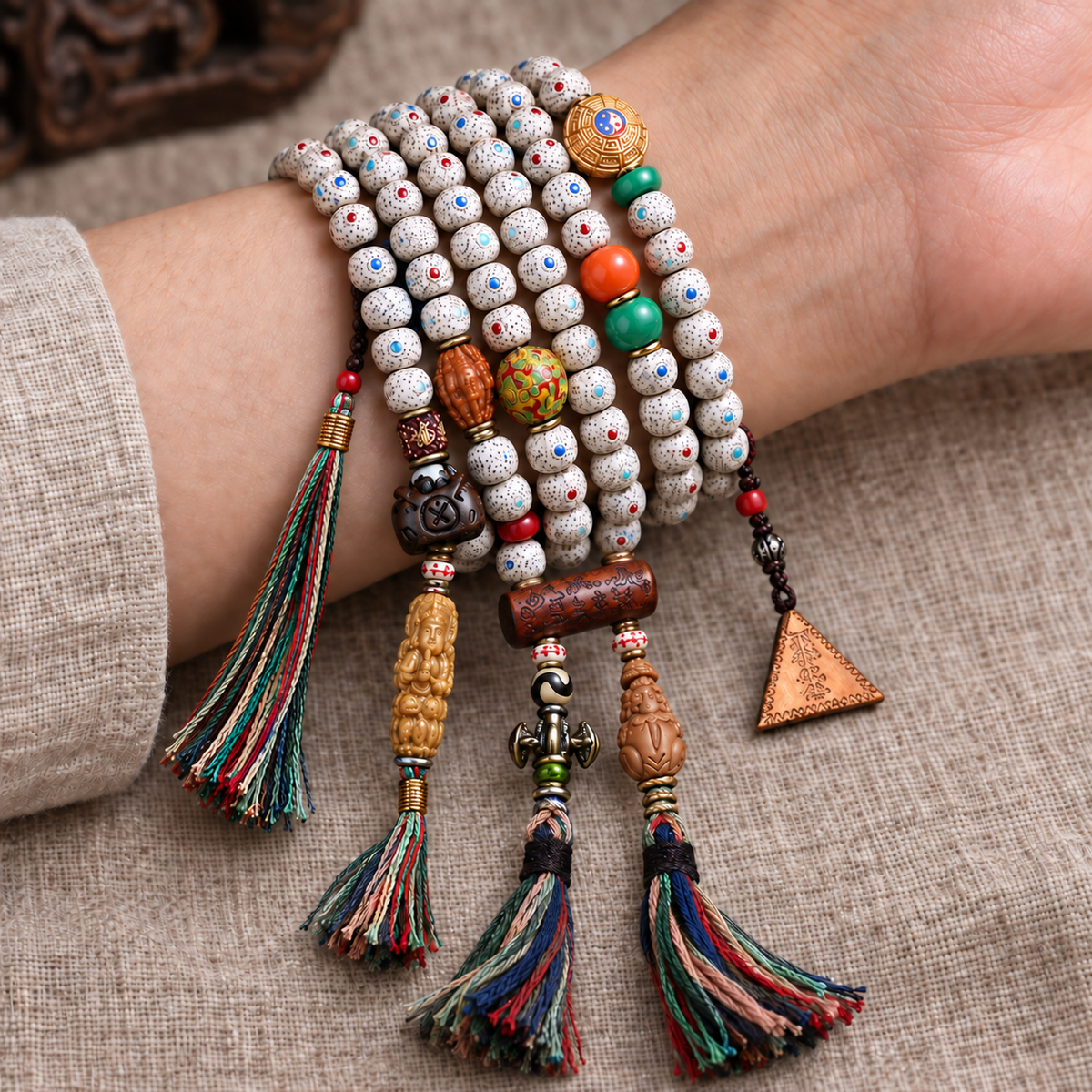 EverestArtstudios Inlaid Xingyue Bodhi 108-Bead Mala with Lacquer and Glass Accents — wrist resting