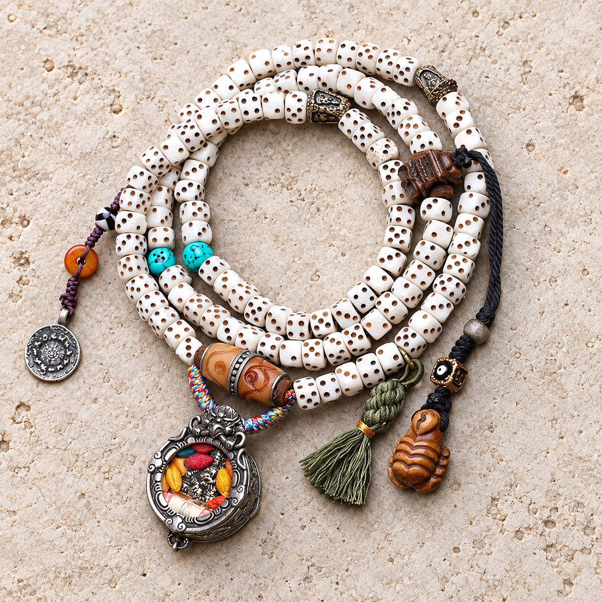 EverestArtstudios Dice-Carved Bone 108-Bead Mala with Ghau and Wealth Deity Pendants — overall display