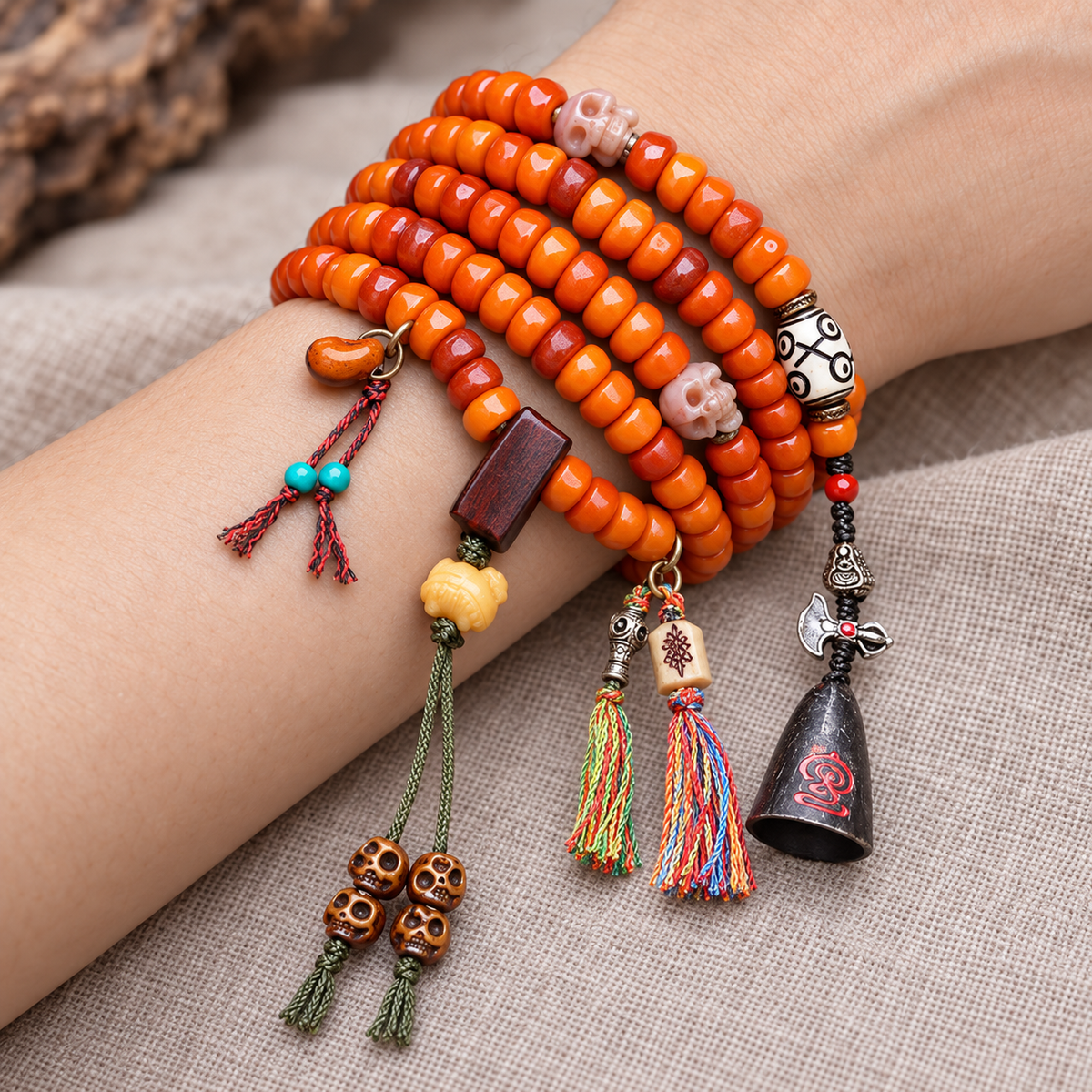 EverestArtstudios Carved Yak Bone Prayer Beads with Sandalwood Accents — wrist resting