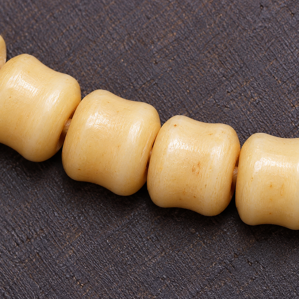 EverestArtstudios Carved Bone 108-Bead Mala with Decorative Metal Charms — surface detail