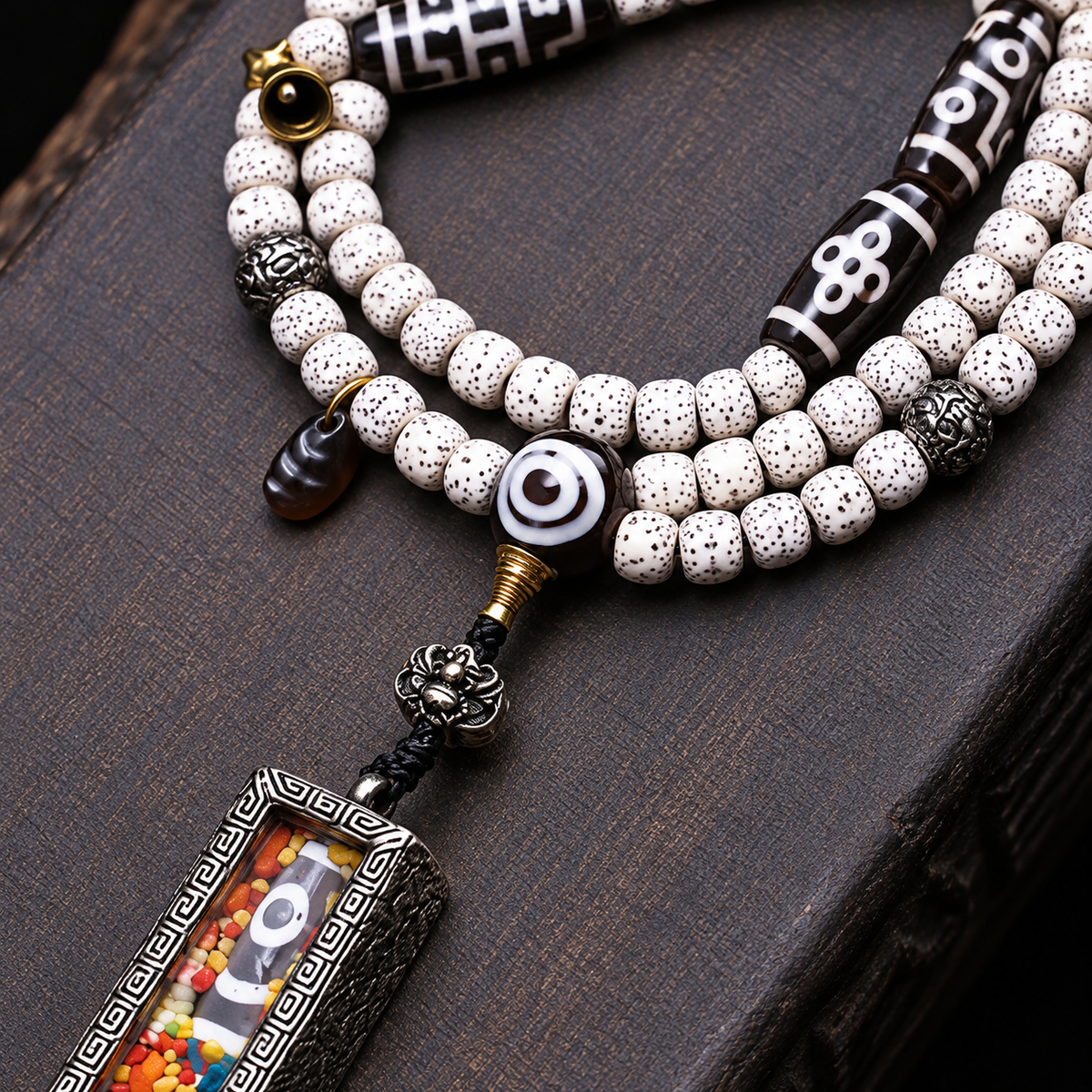 EverestArtstudios Xingyue Bodhi 108-Bead Mala with Two-Eye Dzi-Style Agate and Ghau Pendant — connection detail