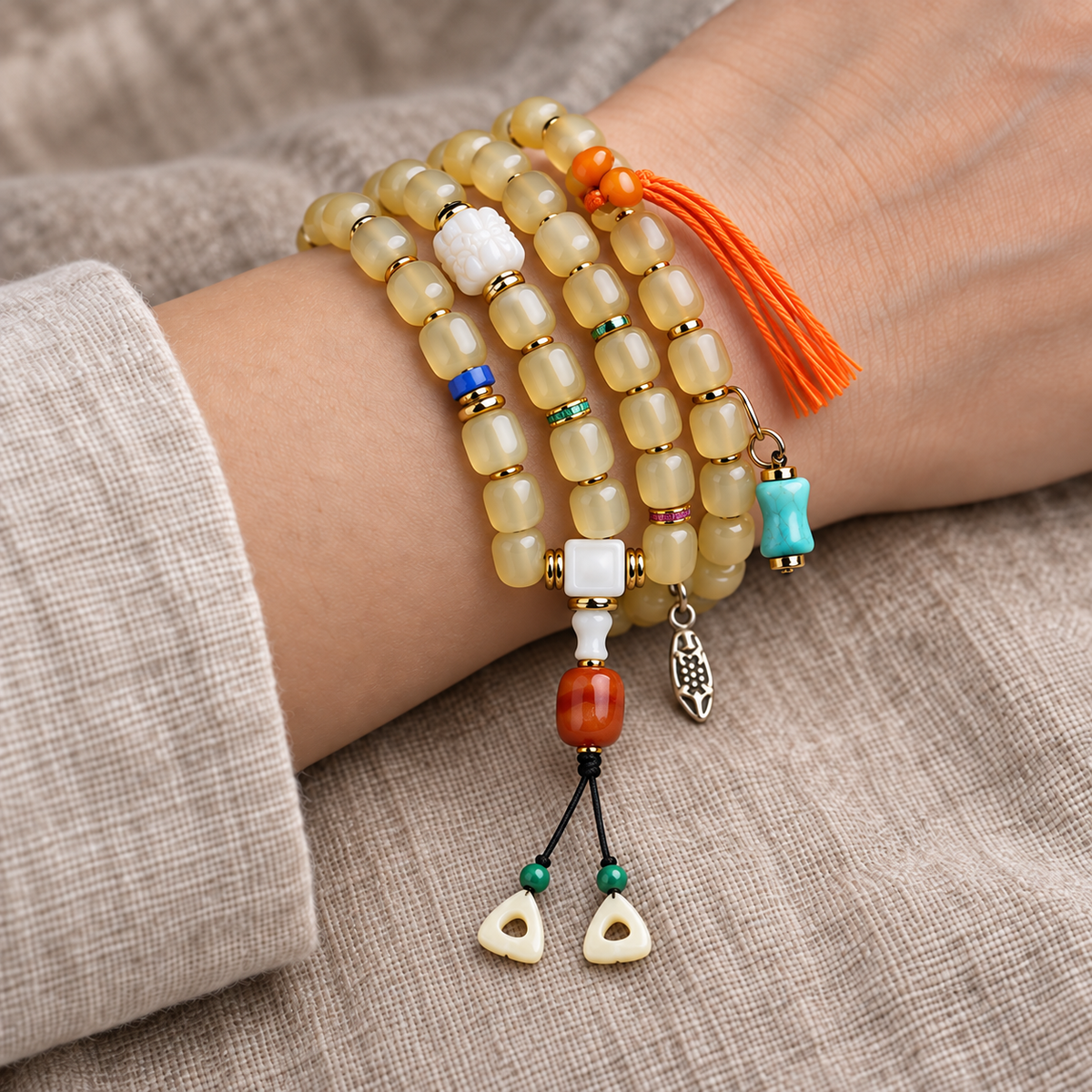 EverestArtstudios Bone 108-Bead Mala with Glass, Agate and Tassel Accents — wrist resting