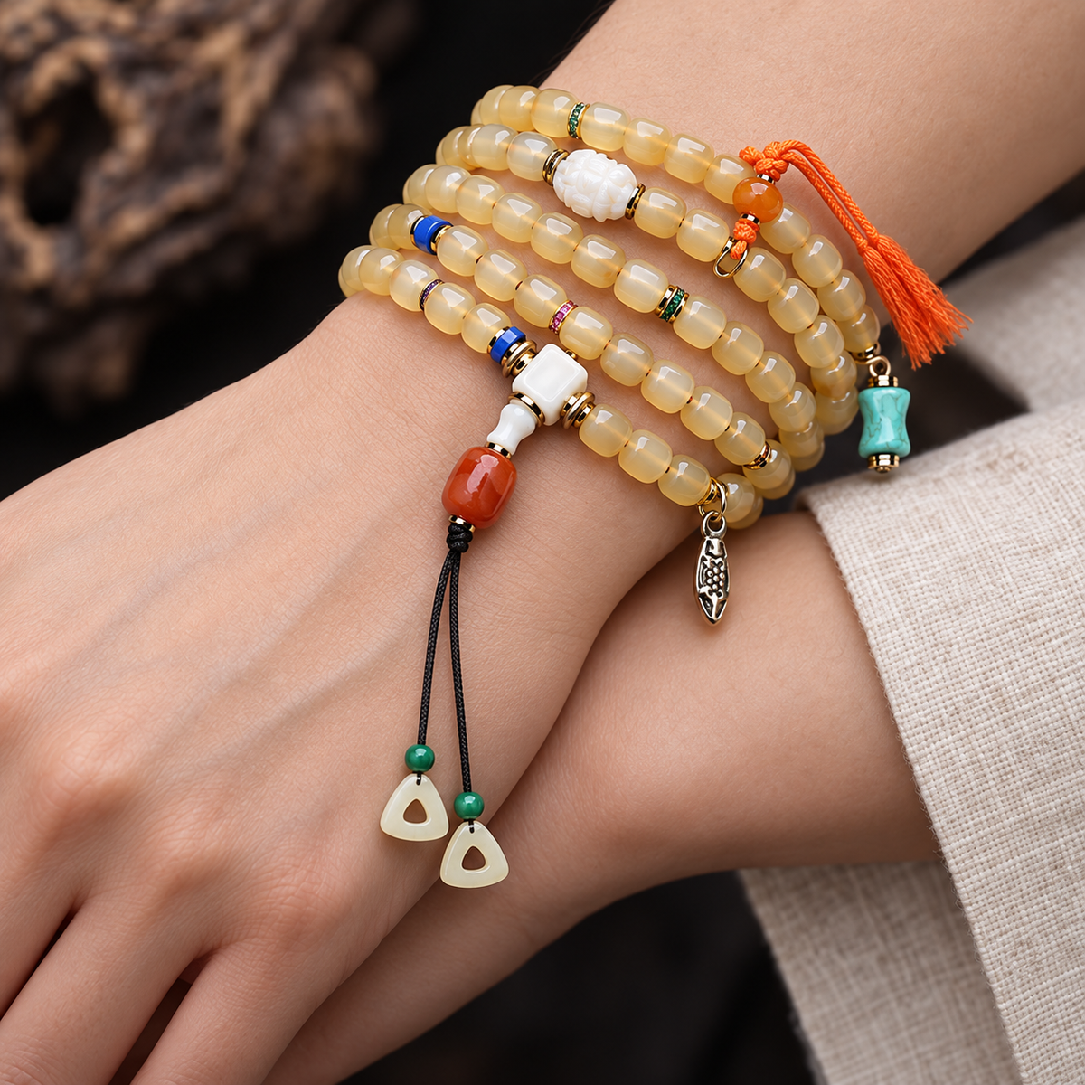 EverestArtstudios Bone 108-Bead Mala with Glass, Agate and Tassel Accents — wrist crossed