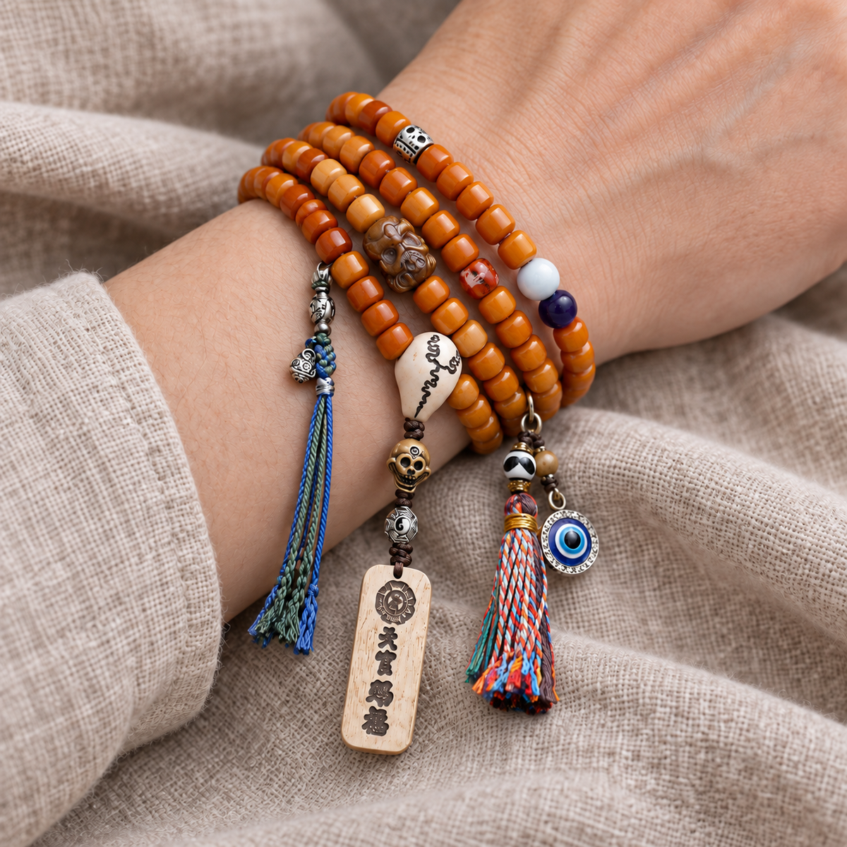 EverestArtstudios Bone 108-Bead Mala with Blessing Pendant and Bird Motif Charms — wrist resting