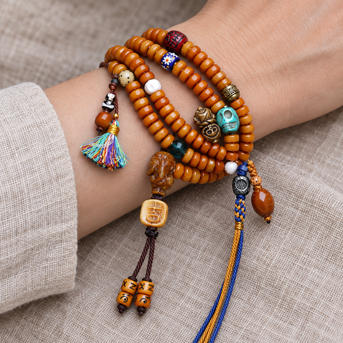 EverestArtstudios Yak Bone 108-Bead Mala with Camel Bone and Elephant Motif Accents — wrist resting