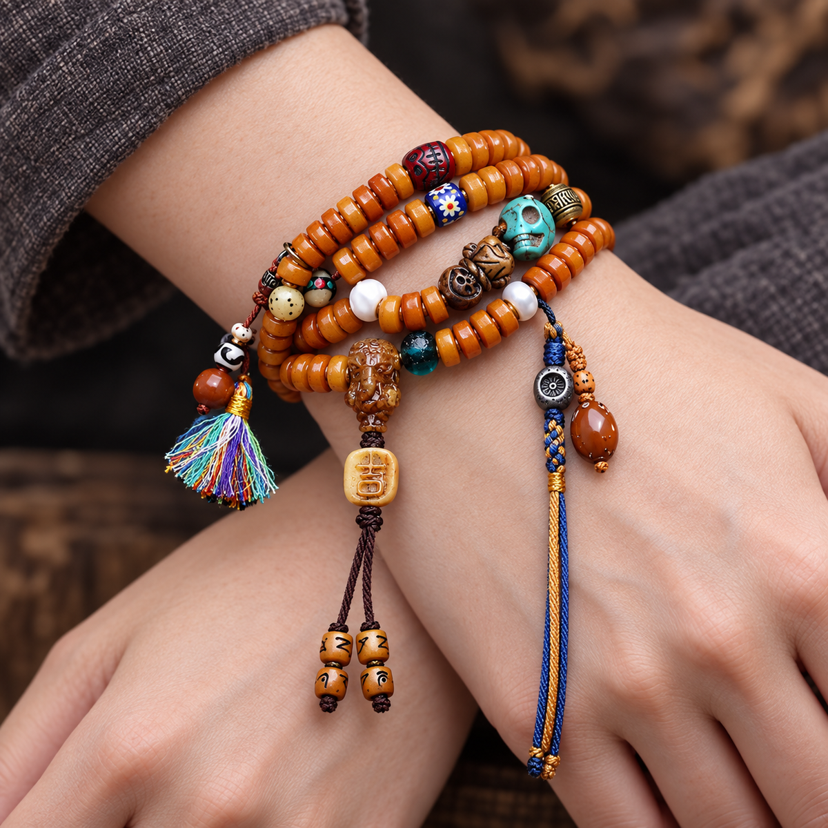 EverestArtstudios Yak Bone 108-Bead Mala with Camel Bone and Elephant Motif Accents — wrist crossed