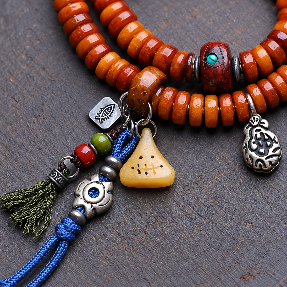 Yak bone mala with Phoenix Eye Bodhi accents — connection detail