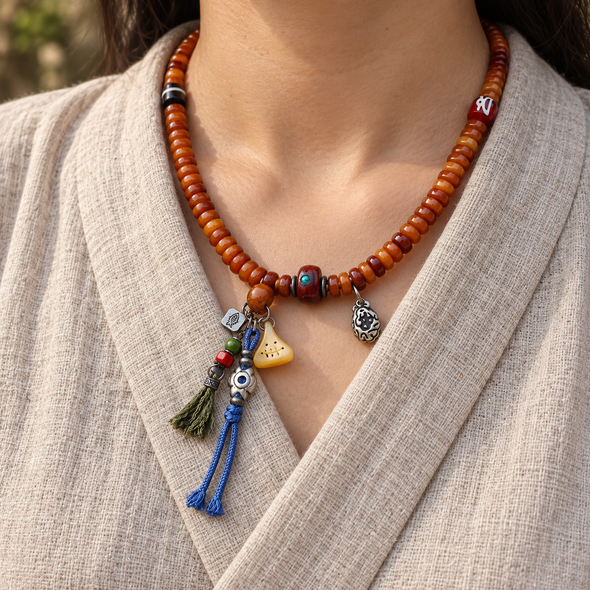 Yak bone mala with Phoenix Eye Bodhi accents — linen seated