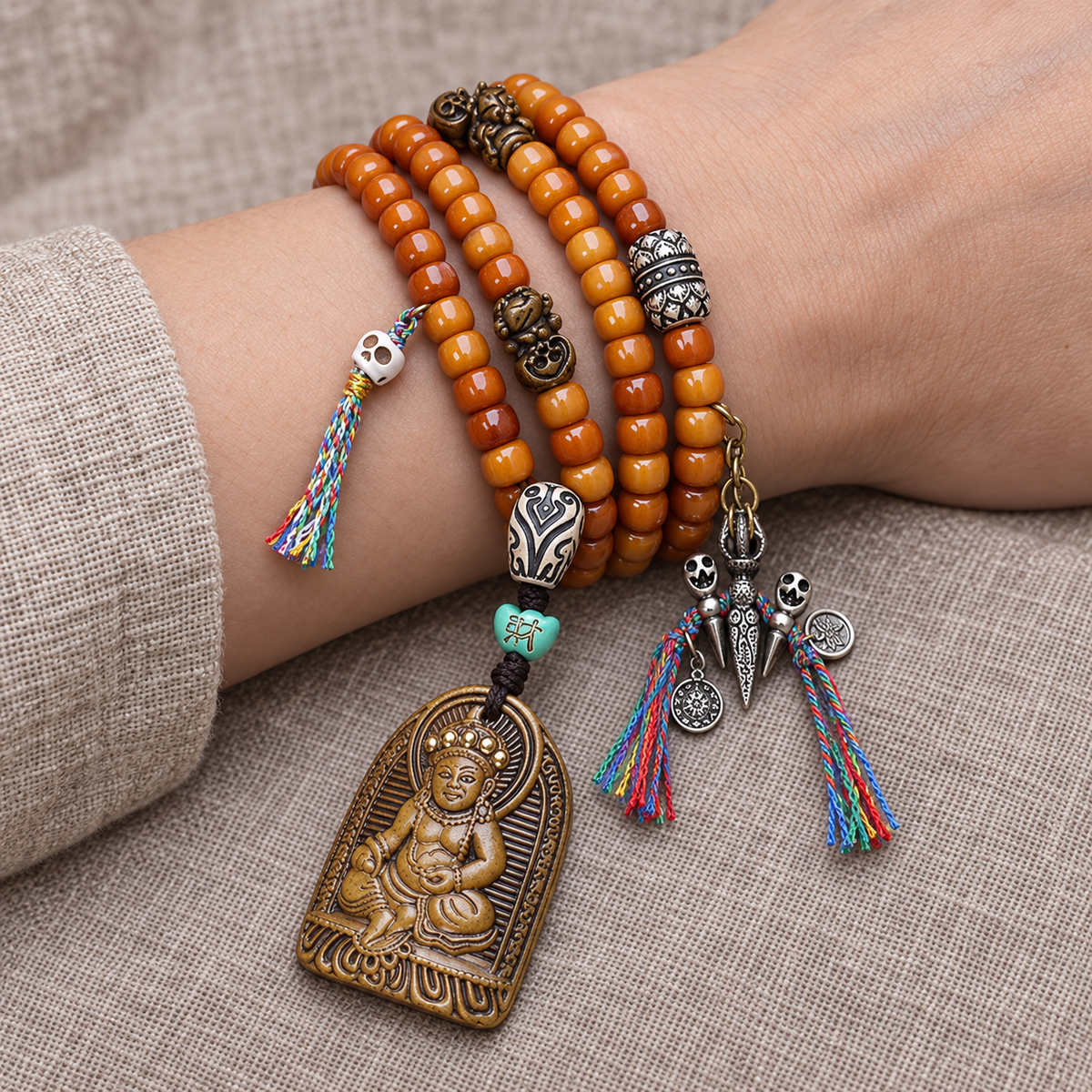 EverestArtstudios Yak Bone 108-Bead Mala with Wealth Deity Pendant and Camel Bone Accents — wrist resting