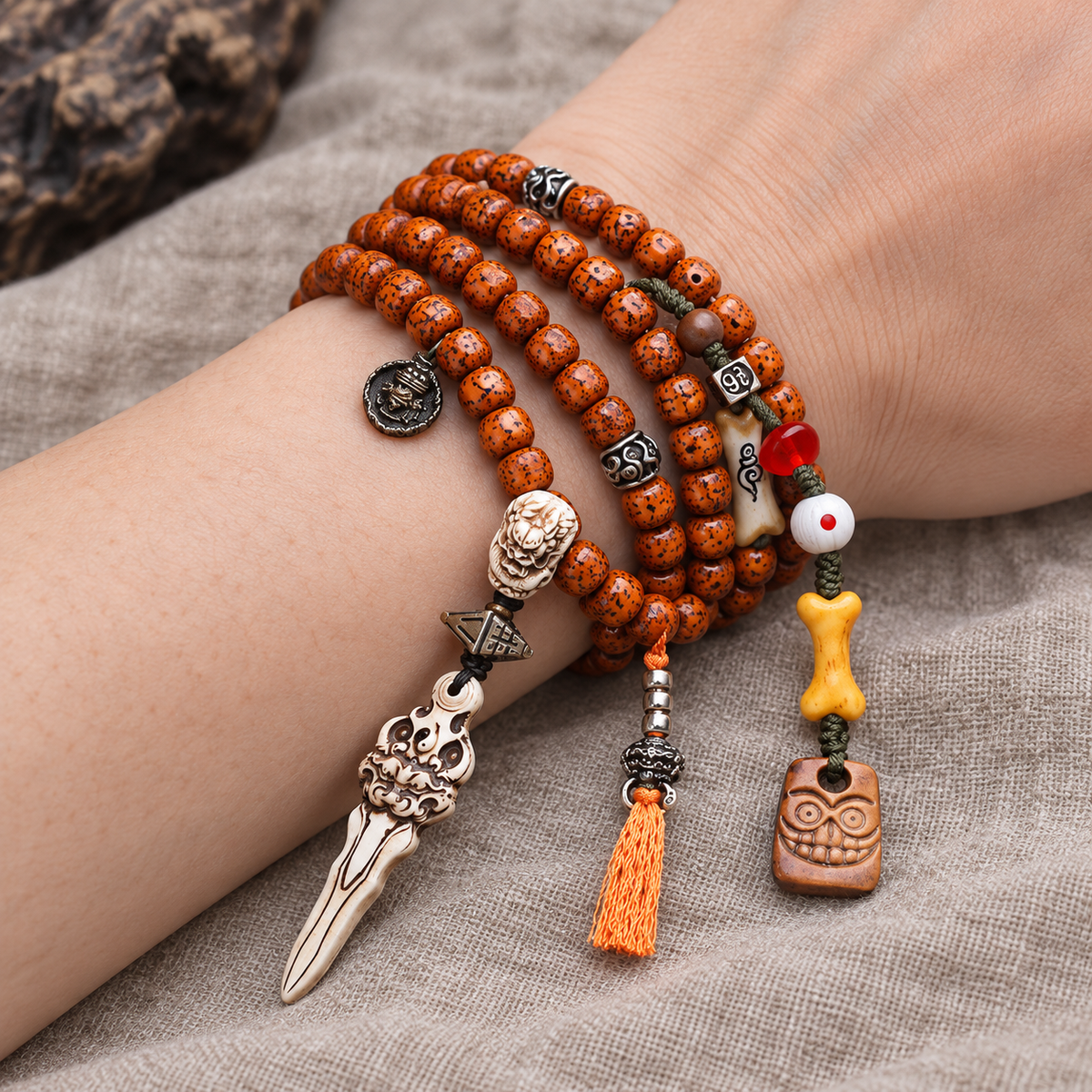 EverestArtstudios Xingyue Bodhi 108-Bead Mala with Yak Bone and Dragon Motif Accents — wrist resting