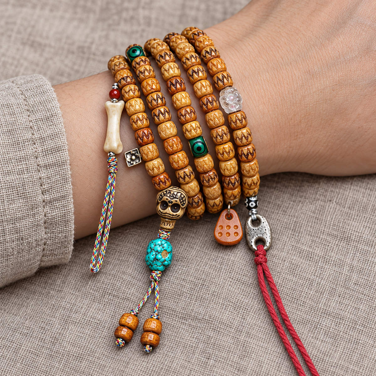EverestArtstudios Carved Bone 108-Bead Mala with Turquoise and Glass Accents — wrist resting