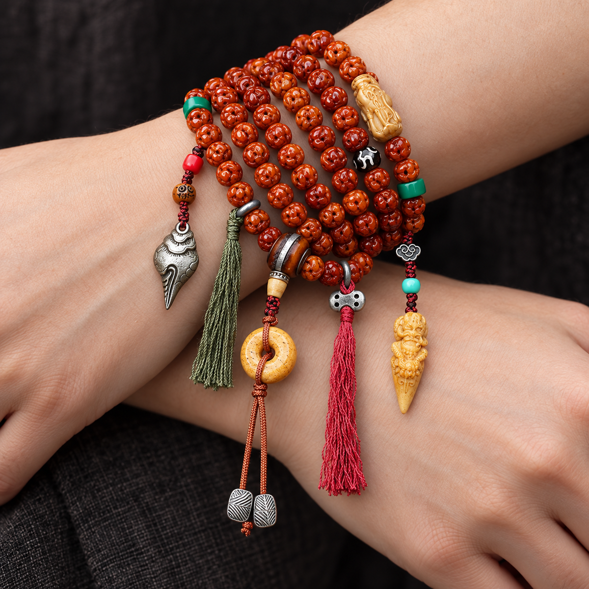 EverestArtstudios Carved Bone 108-Bead Mala with Safety Ring and Bird Motif Charms — wrist crossed