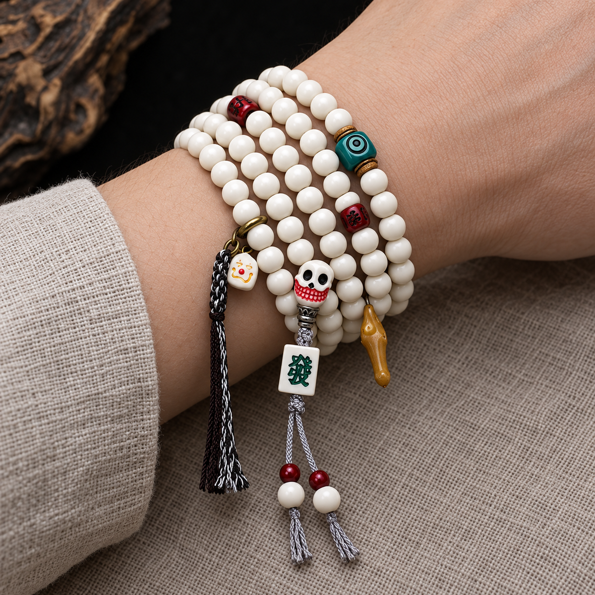 EverestArtstudios Antler 108-Bead Mala with Carved Accents and Fortune Charms — wrist resting