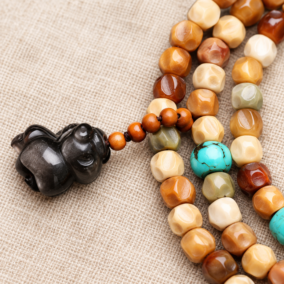 EverestArtstudios Faceted Bodhi 108-Bead Mala with Turquoise and Obsidian Accents — carved detail