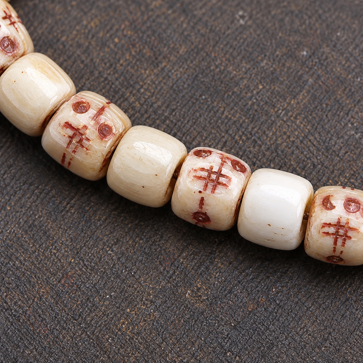 EverestArtstudios Carved Fish Bone 108-Bead Mala with Colorful Accents and Curved Pendant — bead detail