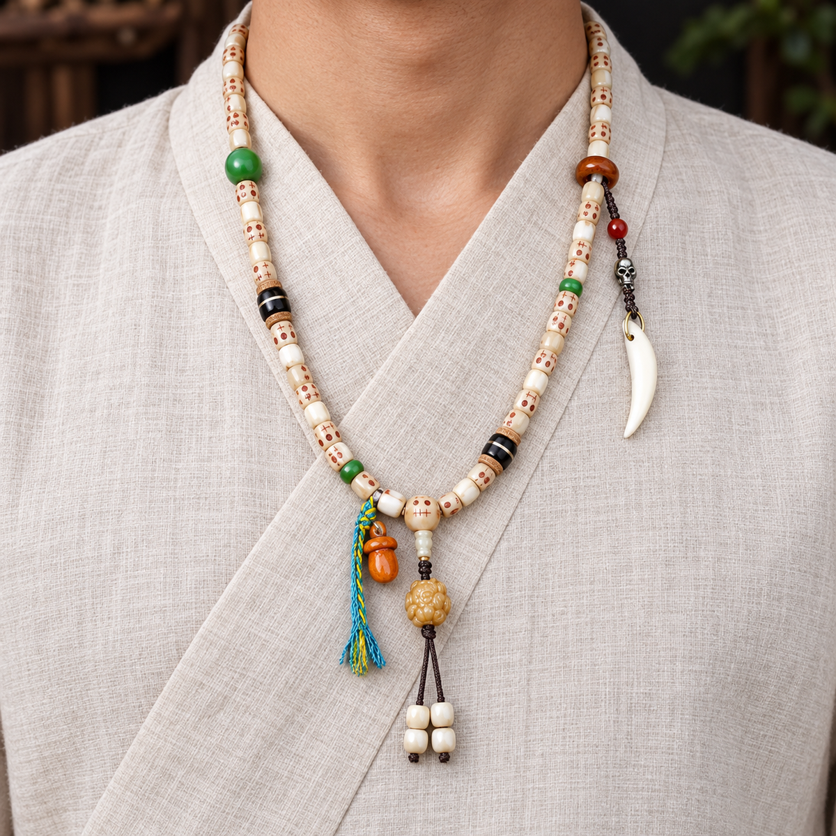 EverestArtstudios Carved Fish Bone 108-Bead Mala with Colorful Accents and Curved Pendant — linen front