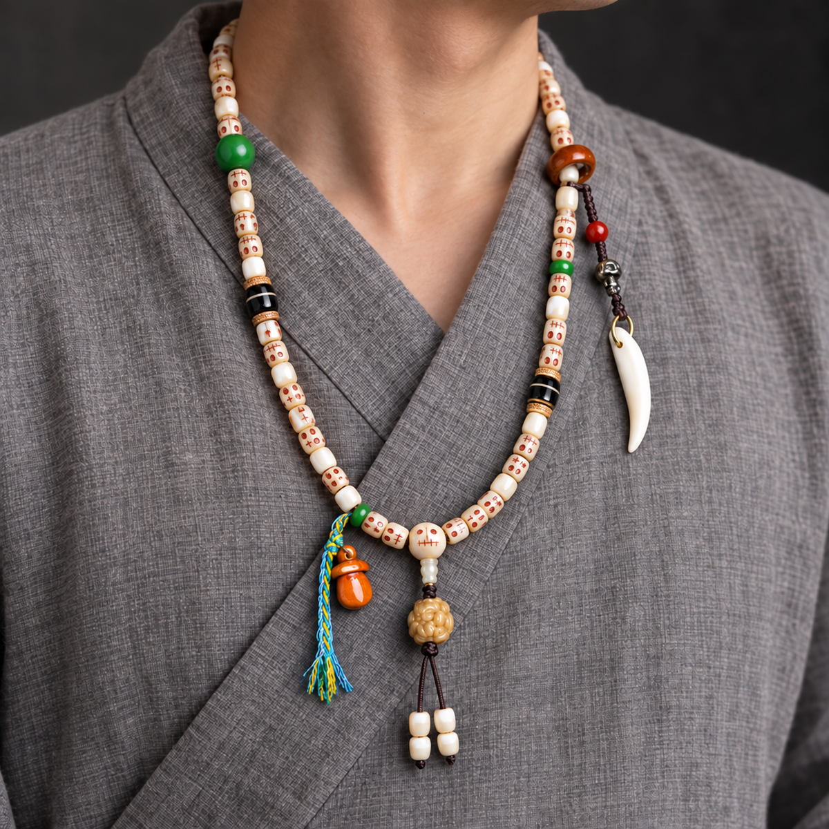 EverestArtstudios Carved Fish Bone 108-Bead Mala with Colorful Accents and Curved Pendant — linen side